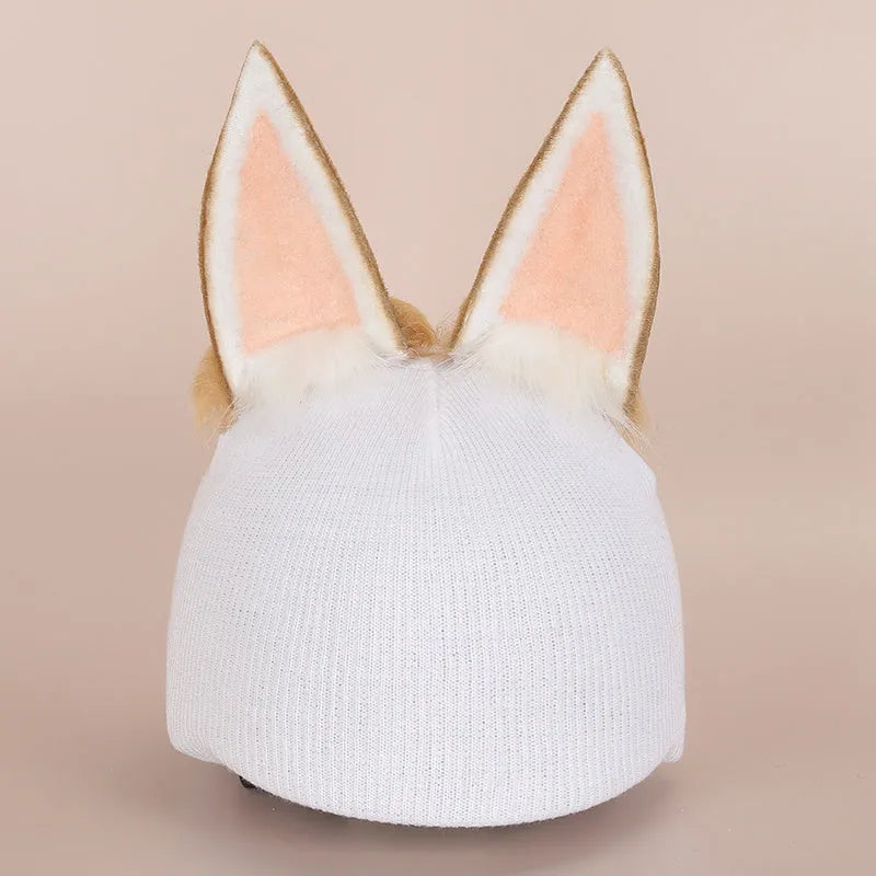 Colourful plush cartoon hat decoration sitting on top of a ski helmet