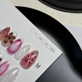 Hand-painted three-dimensional false nails with embossed carved patterns in candy colours.