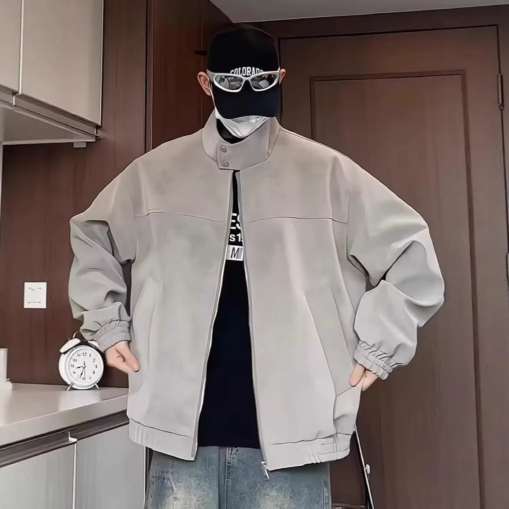 Man modelling a grey tie-dyed PU leather jacket with a stand collar and side pockets.