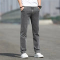 Men's smoky gray straight leg jeans with low waist and zipper fly, made from rabbit fur fabric.