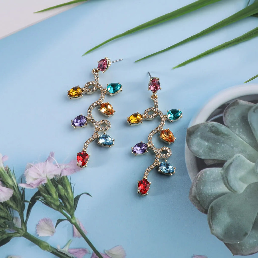 Retro fashion small lantern zircon stud earrings in colourful alloy on white background