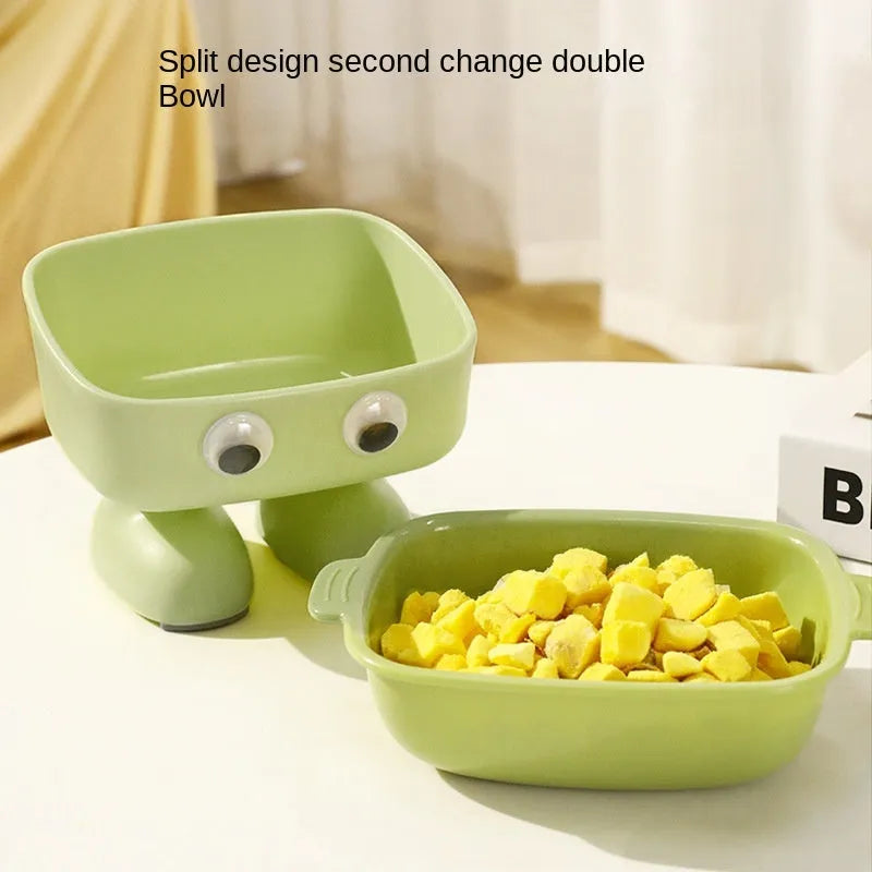 Green robot-shaped elevated cat bowl with tilted food surface and non-slip base