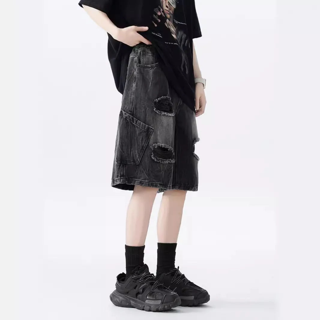 Retro washed denim shorts with loose fit and distressed ripped detailing in black or blue