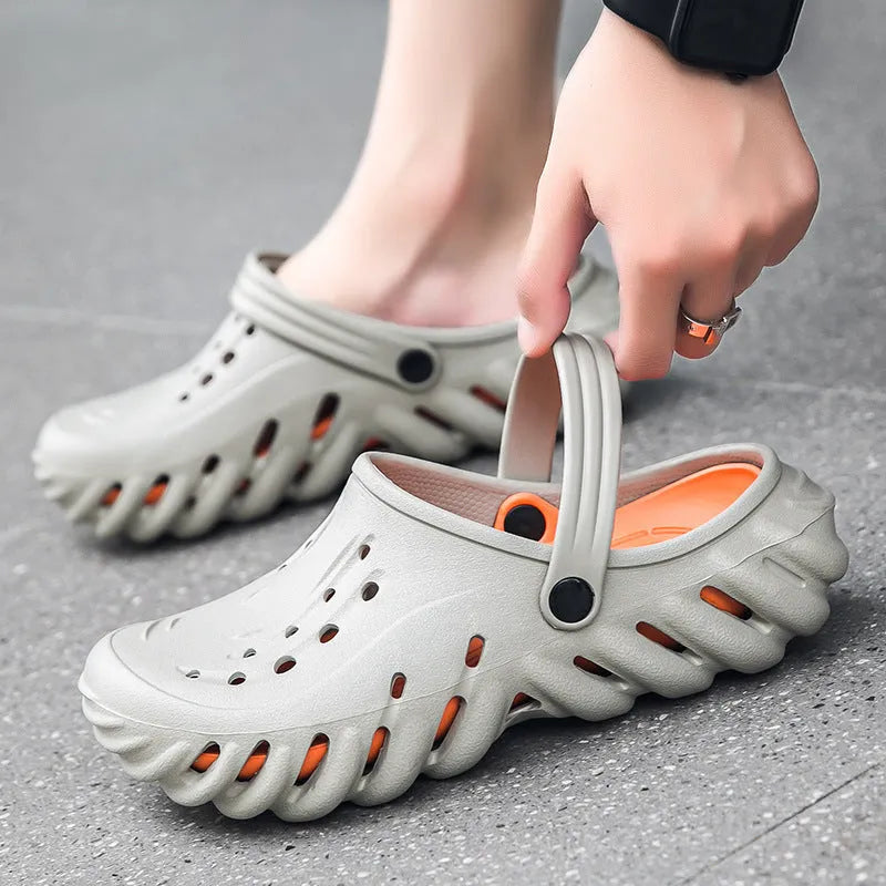 Men's beige EVA hole shoes sandals with hollow out design and round toe on a non-slip sole.