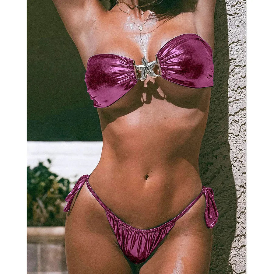 Women's glossy sapphire blue bikini set with gold starfish decoration, showing tube top and briefs.