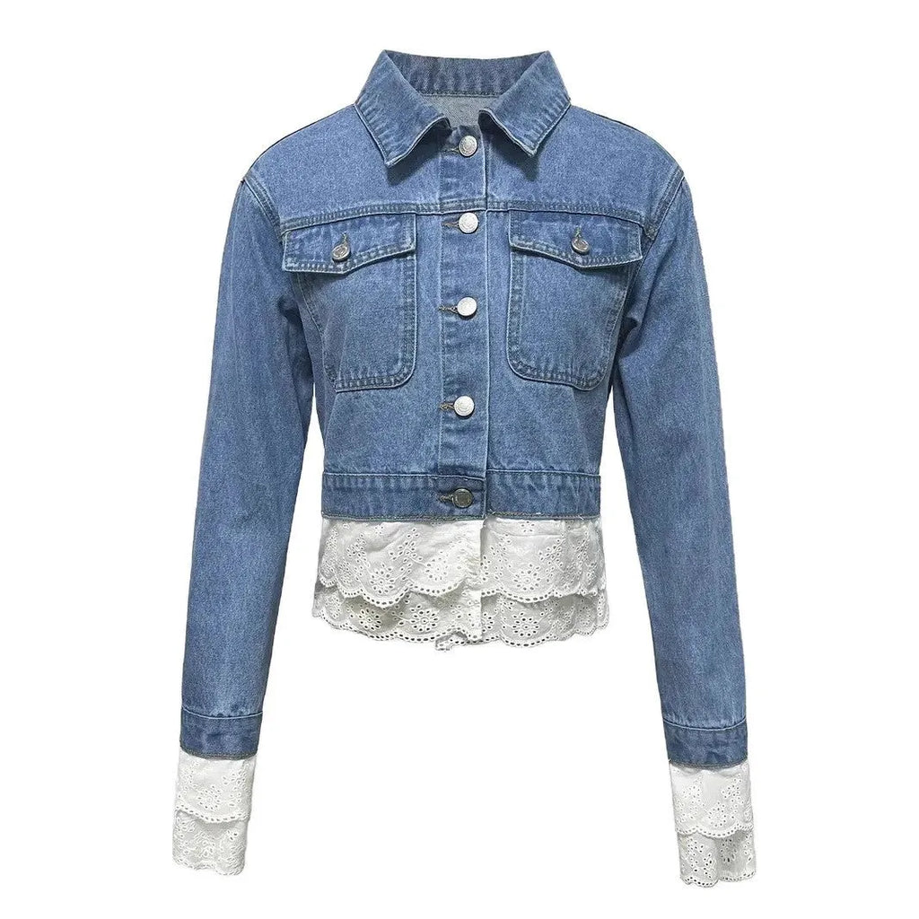 Blue women's denim jacket with lace stitching detail, shown on a hanger.