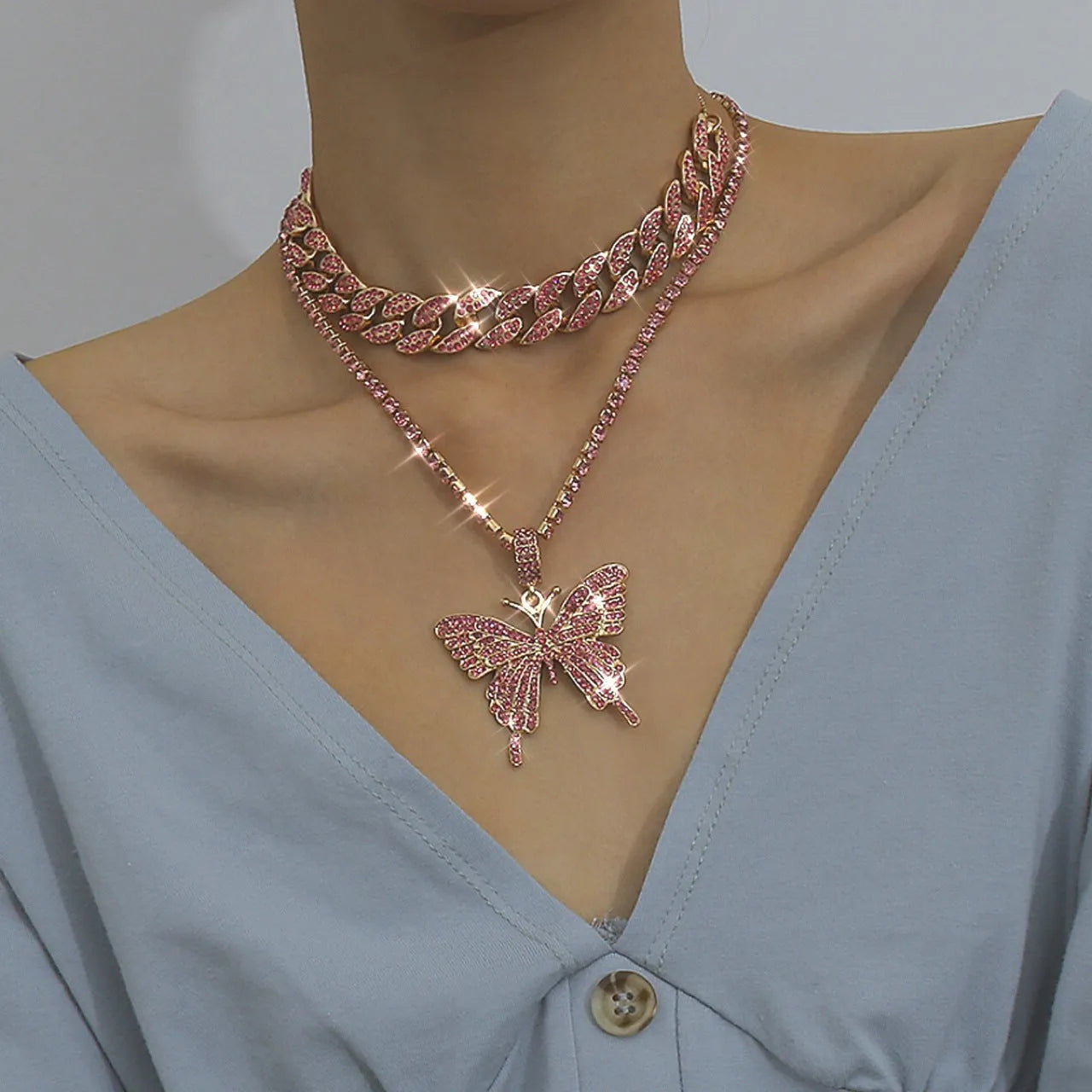 Butterfly-shaped alloy pendant necklace with rhinestone accents, gold electroplated finish