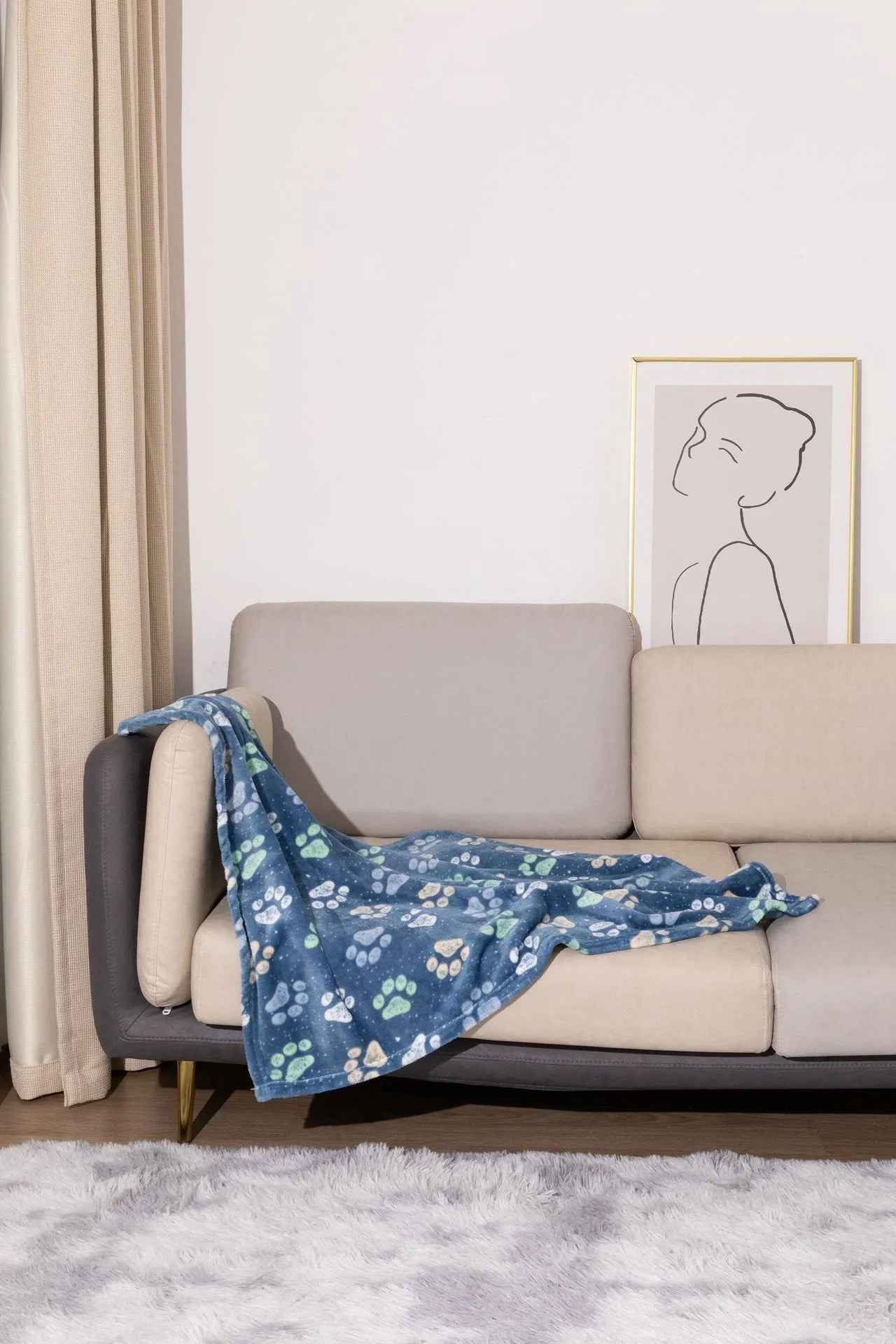 Blue dog cartoon print pet blanket laid flat, showing double-sided flannel texture.