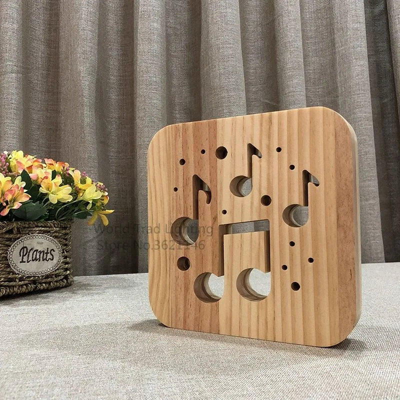 Square pine wood USB LED lamp emitting warm white 3D pattern light on a dark surface.