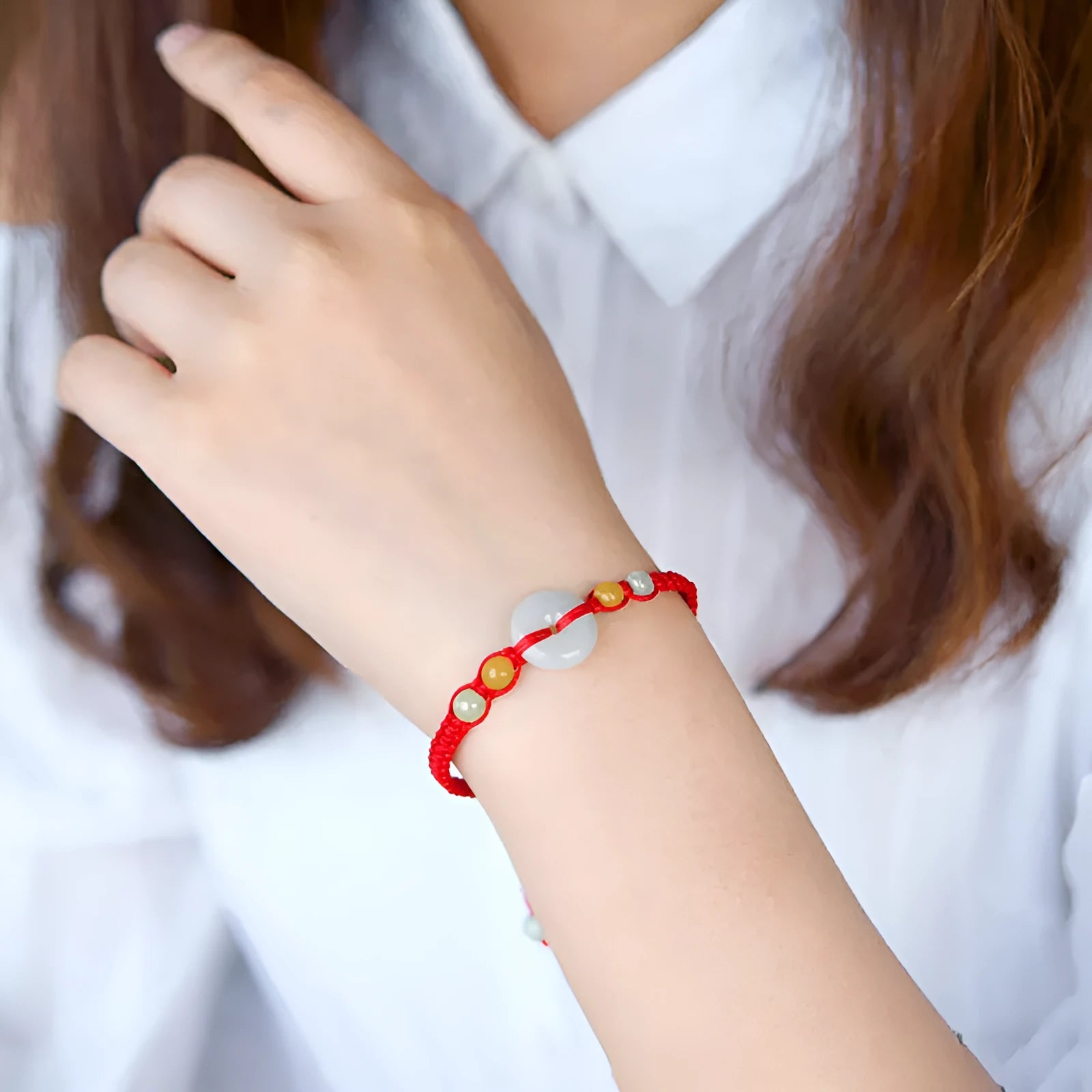 Round emerald-cut jade pendant on adjustable red rope bracelet with 14-20cm wrist fit
