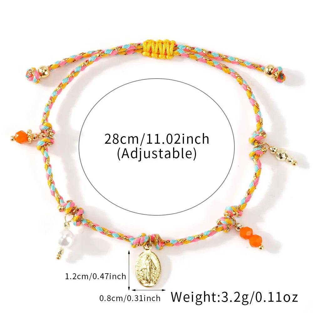 Close-up of a colourful hand-woven adjustable bracelet with an ethnic-style strap tag on a wrist.