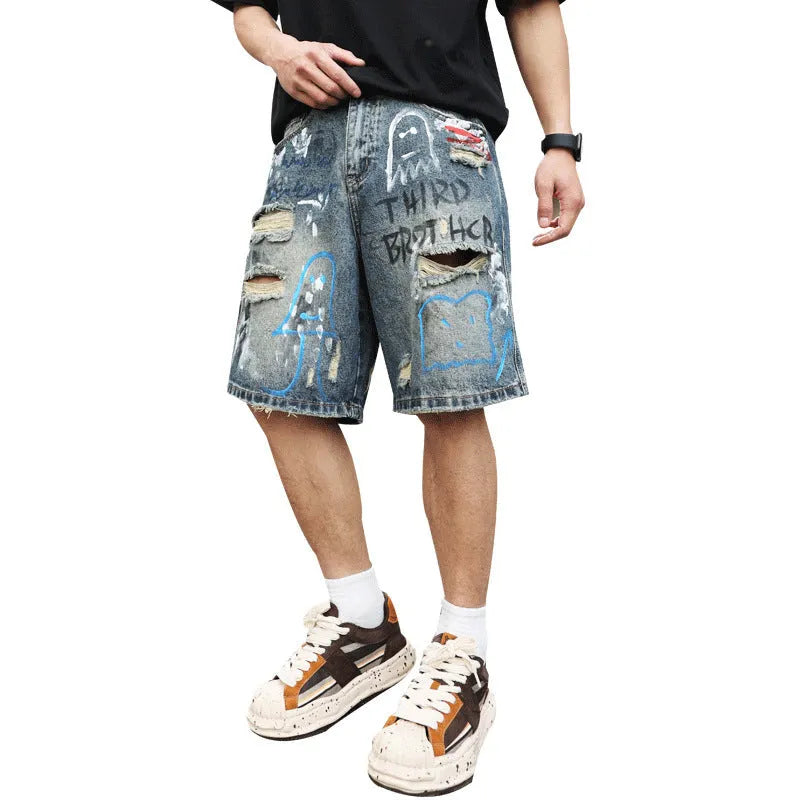 Blue denim shorts for men with ripped knees and graffiti design, featuring a straight leg and zipper fly.