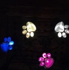 Black bear paw print solar garden light with integrated solar panel pole