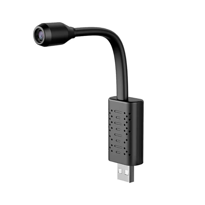 Black V380 wireless USB camera on a stand next to a microSD card and mobile power bank