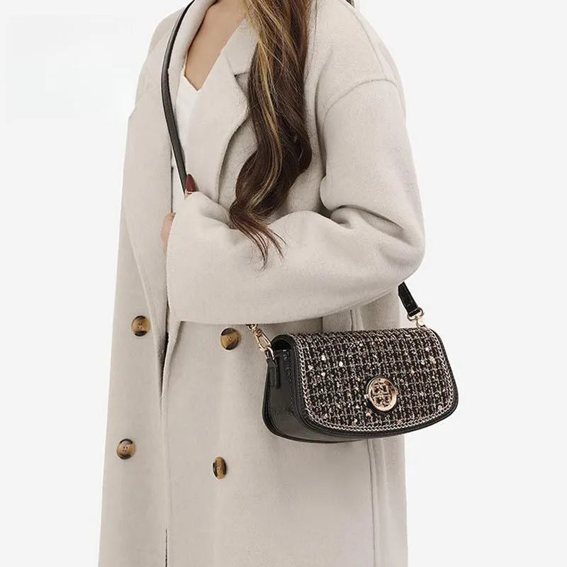 Black polyester crossbody underarm chain shoulder bag with chain strap on white background