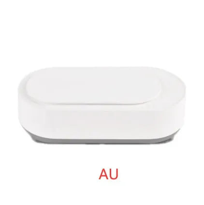 White portable ultrasonic cleaner with stainless steel tank and a single control button.