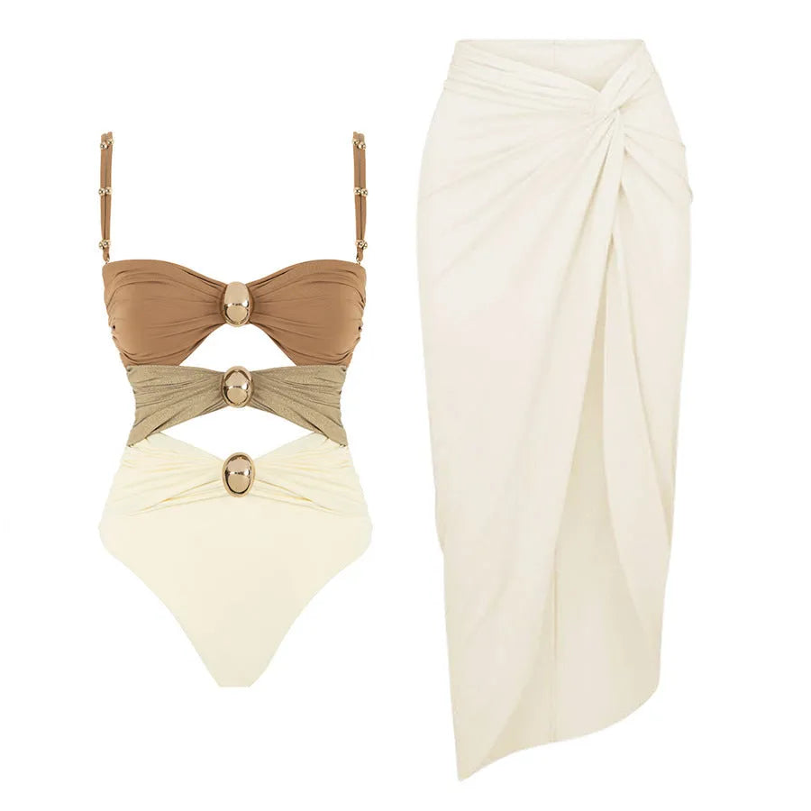 Women's one-piece swimsuit with matching skirt in solid colour with gold button accents