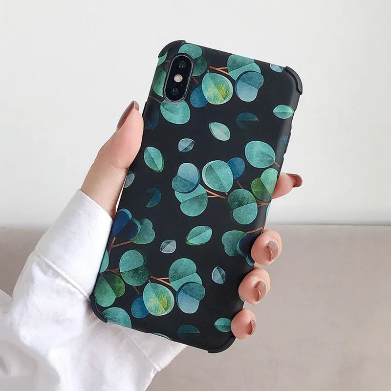 Black silicone iPhone case featuring a raised leaf pattern design on the back.