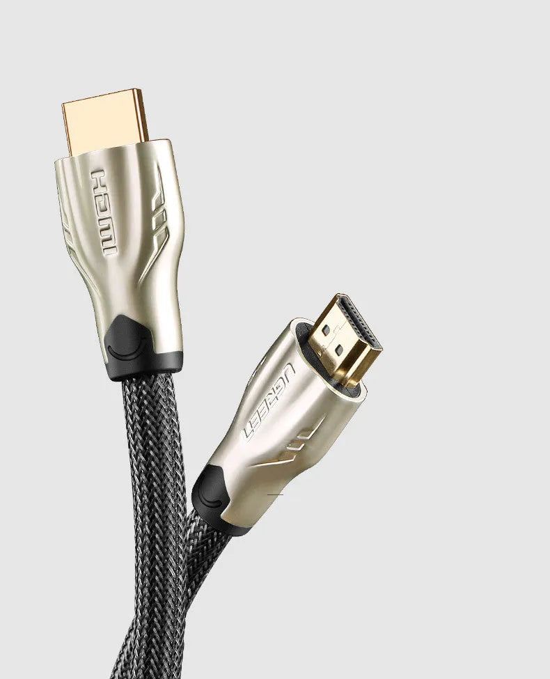 Close-up of a black HDMI cable with gold-plated connectors, showing its triple-shielded construction and PVC jacket.