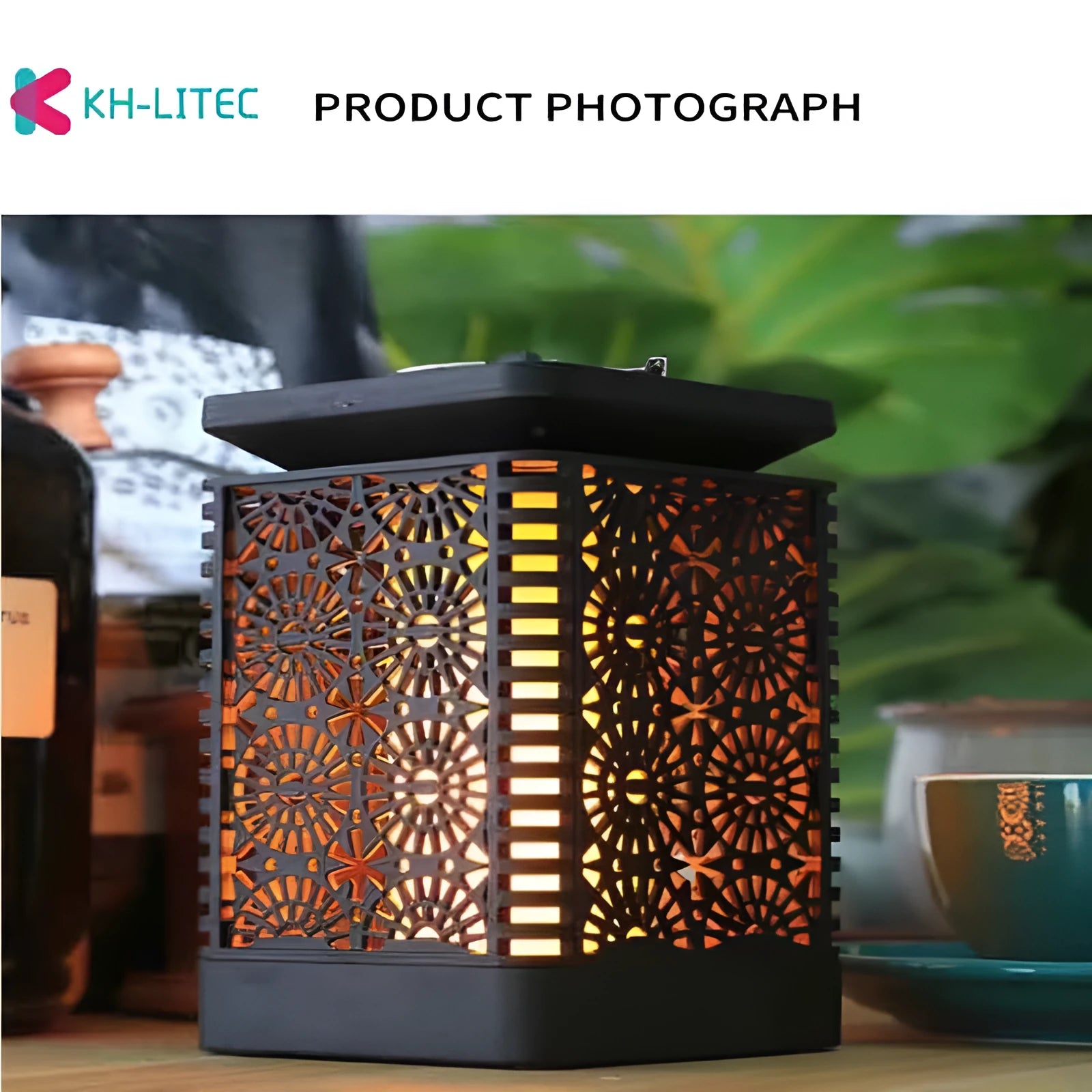 Set of four black solar-powered hanging torch lights with flickering flame LED for outdoor garden use.