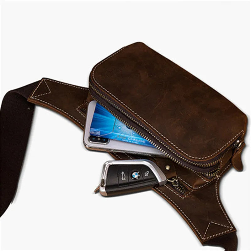 Brown top-grain cowhide men's sports waist bag with pull-cord closure, shown with a 10-inch laptop.