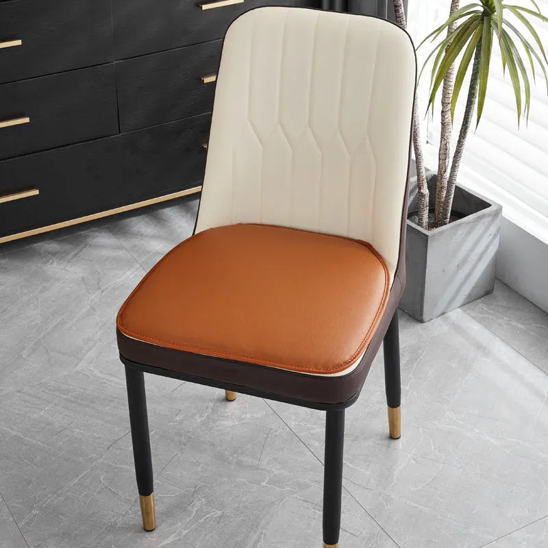 Leather horseshoe-shaped seat cushion with non-slip base in beige colour