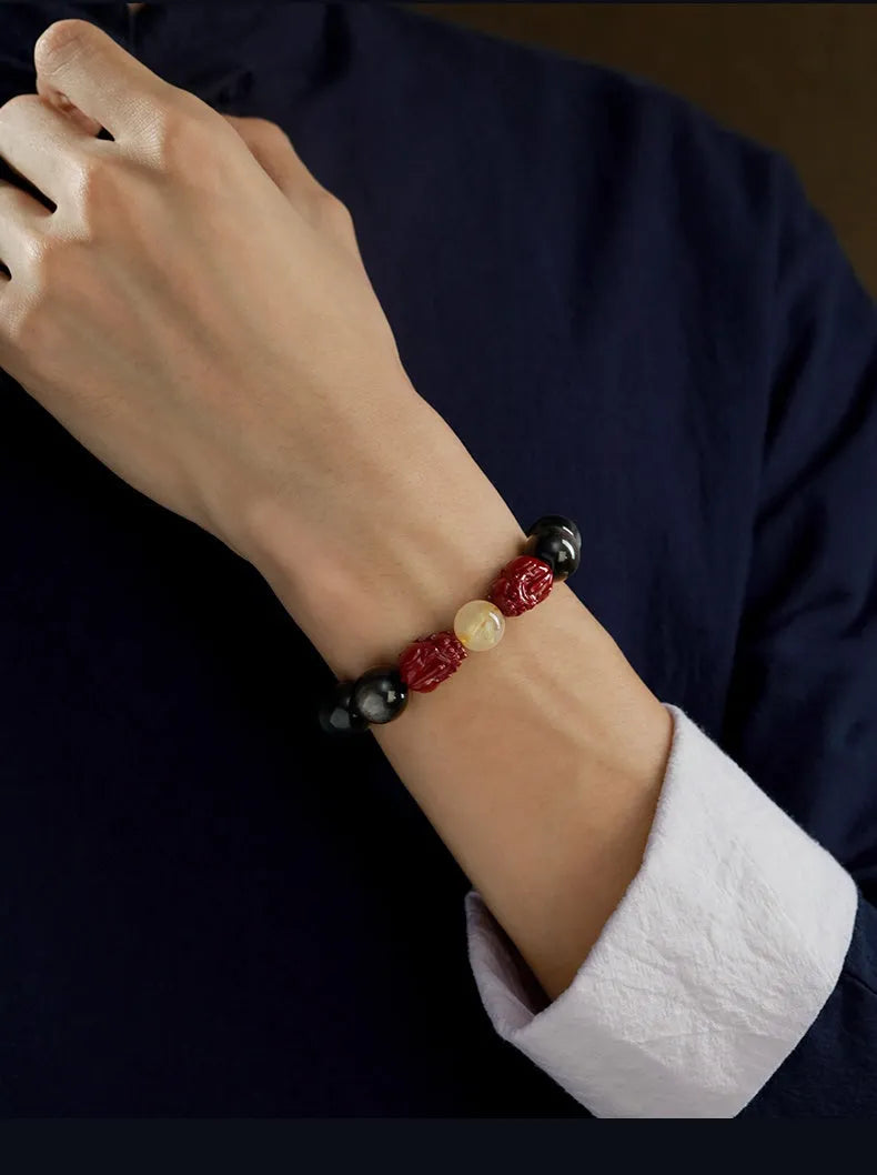 Cinnabar beads bracelet with hand-carved gold animal zodiac charms in cartoon retro style