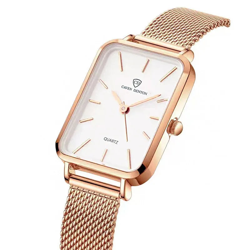 Rose gold and silver women's waterproof quartz watch with woven steel strap on a wrist.