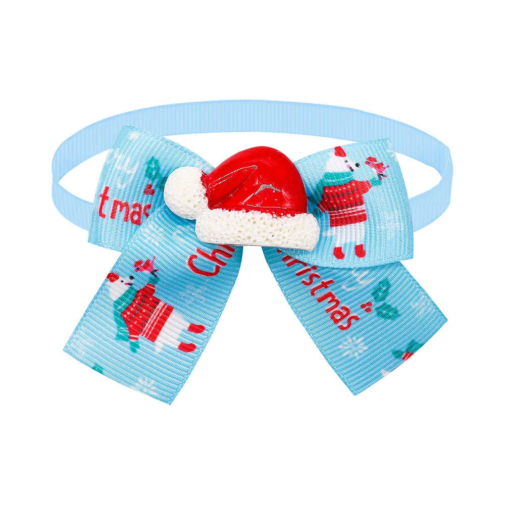 Red and green polyester Christmas pet bow tie in British style on a white background