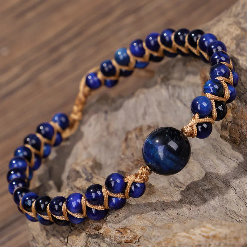 Handmade woven geometric pull bracelet in Tigereye stone showing blue and amethyst colour options
