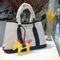Women's genuine leather and canvas crossbody tote bucket bag in black, brown, gray, or red colour options