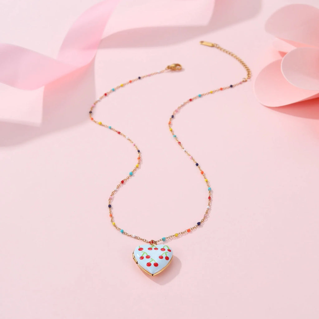 Gold-plated stainless steel necklace with a detailed strawberry-shaped pendant on a chain.