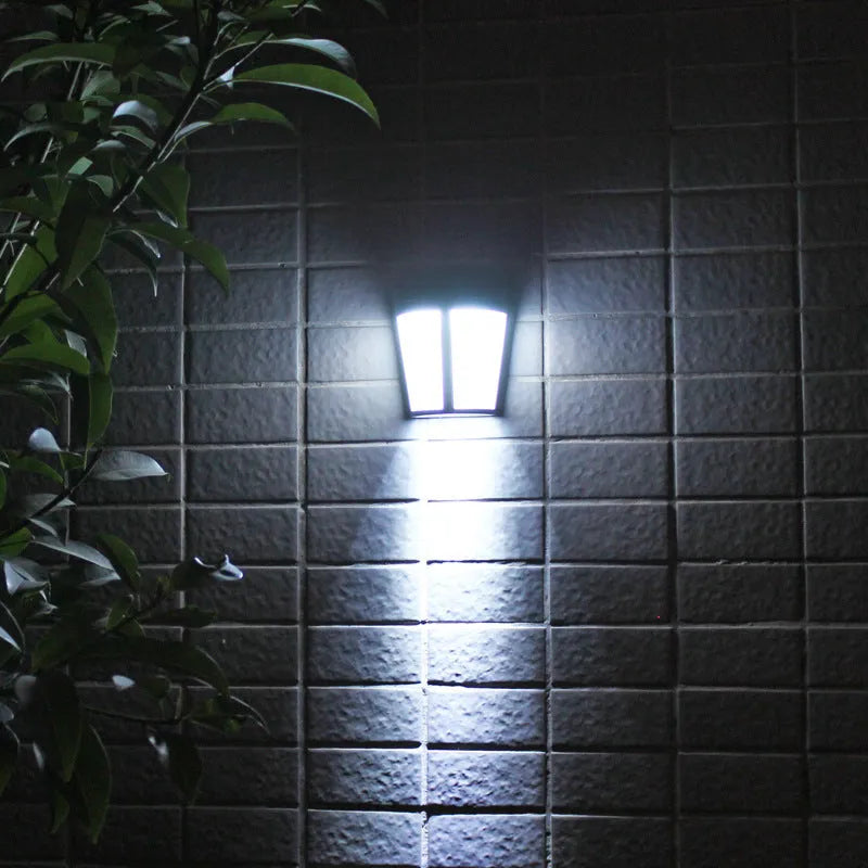 Solar-powered outdoor wall lamp with 6 LEDs and automatic sensor for garden pathway lighting