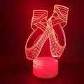 Ballet dancer 3D LED night light with remote control on a table.