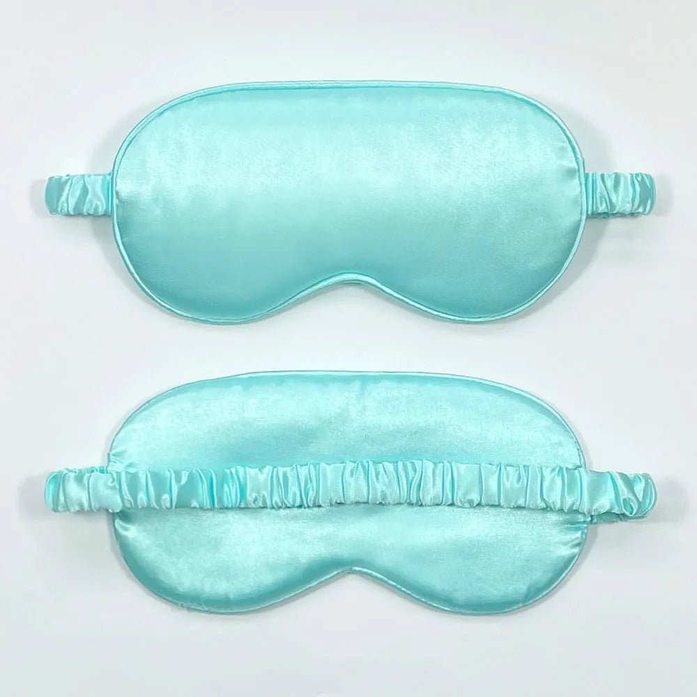 Rayon satin double-sided sleep mask in a selection of solid colours on a white background.