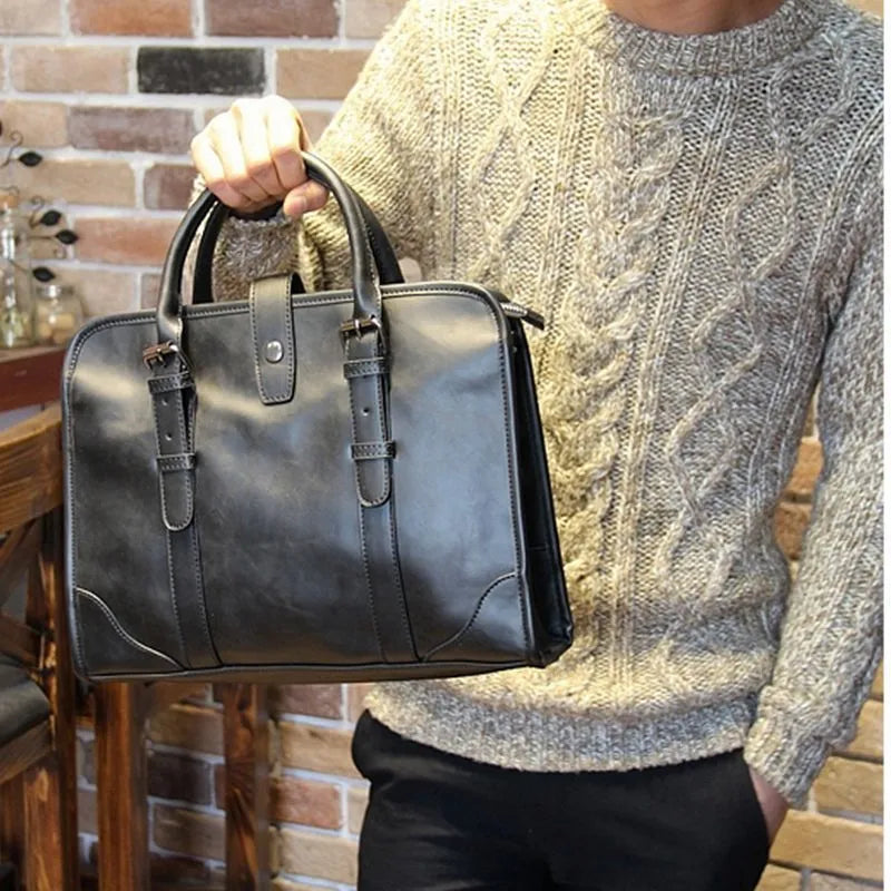 Men's cowhide leather handbag in black, horizontal square shape, medium size, with zipper closure and hard handle