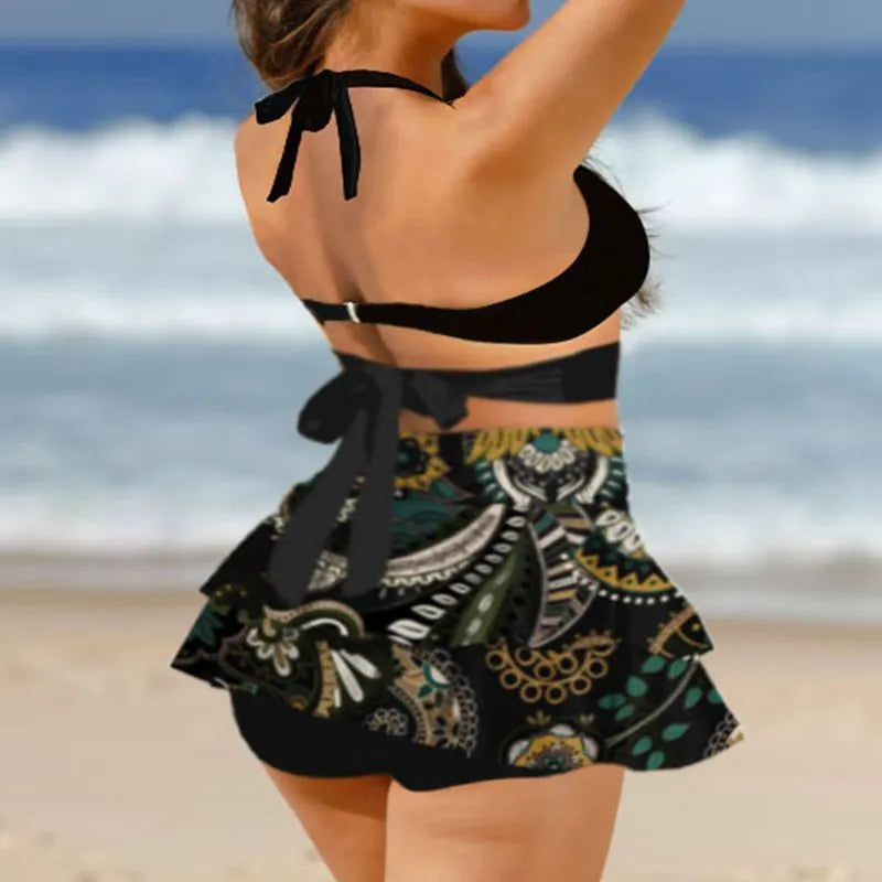Purple women's bikini set with lace-up front and high-waisted split skirt.