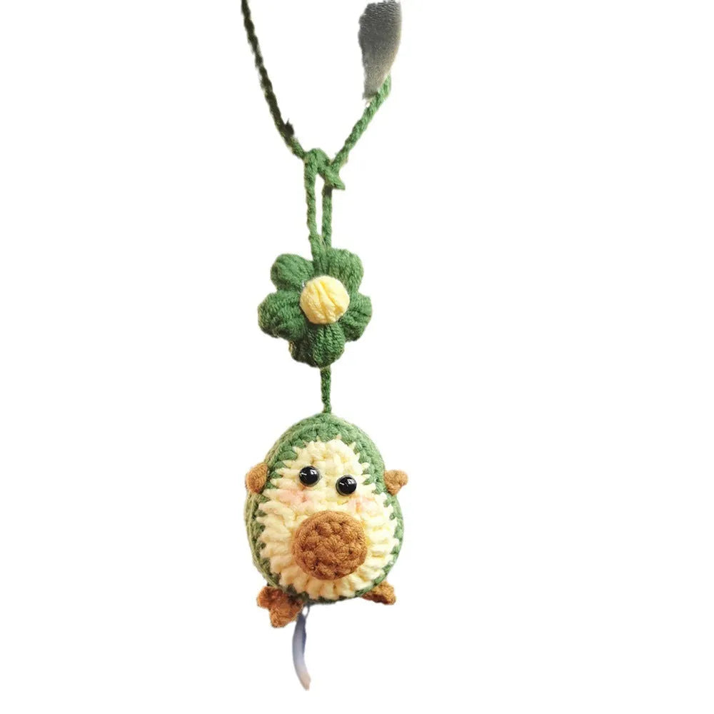 Handmade crocheted wool car pendant in avocado, pink rainbow, or red rainbow colour with cartoon flower design.