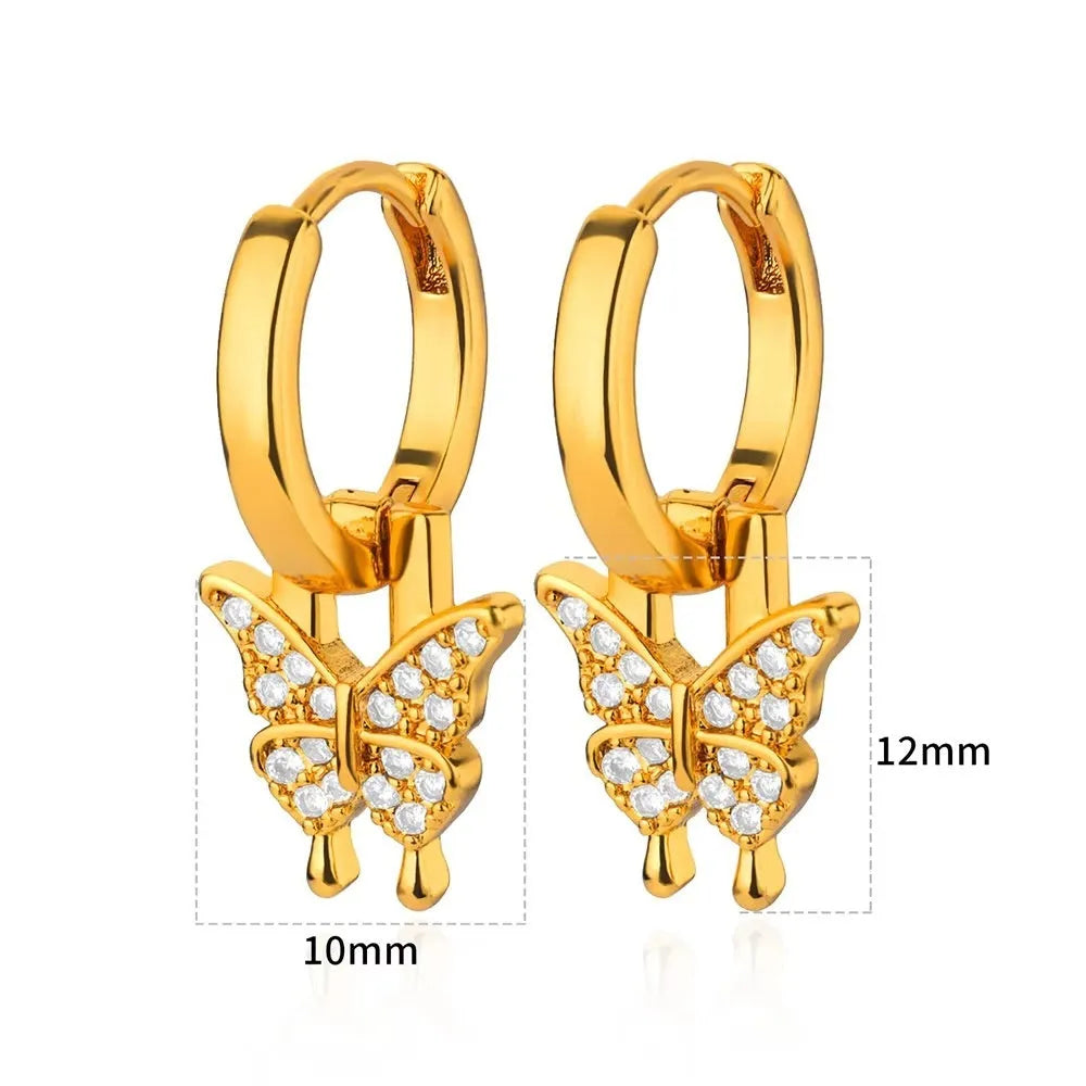 Women's geometric butterfly-shaped copper earrings with heart and star details in various colours.