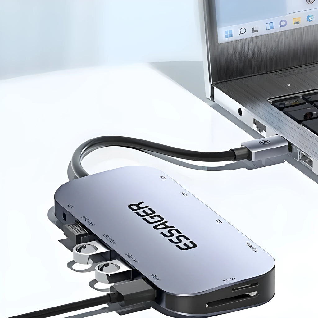 Grey aluminium 11-in-1 USB-C expansion dock hub with attached cable, showing multiple ports including HDMI, VGA, Ethernet, and USB.