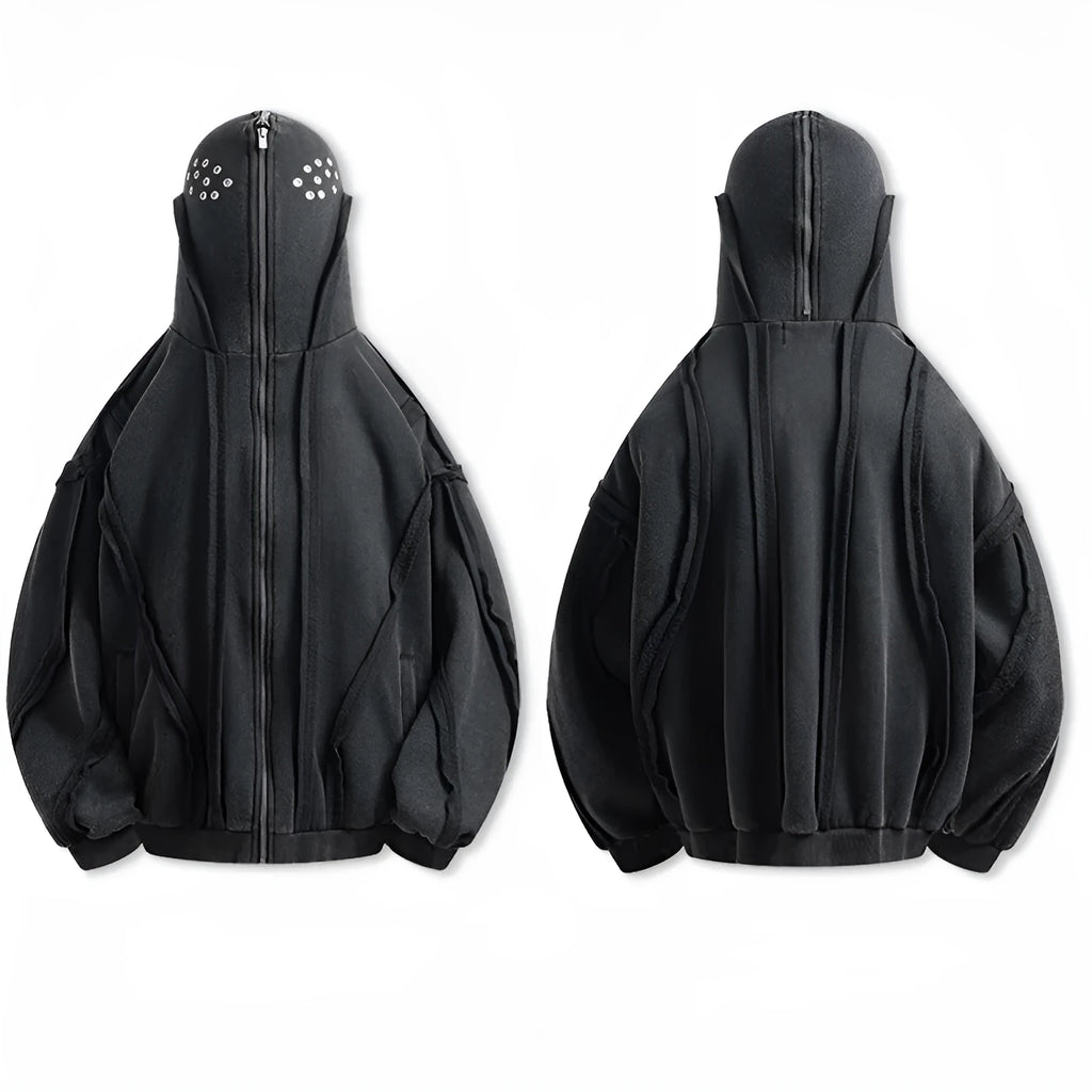 Black loose-fit zip-up hooded coat with an abstract pattern and padding worn as an autumn layer.