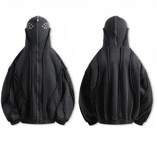 Black loose-fit zip-up hooded coat with an abstract pattern and padding worn as an autumn layer.