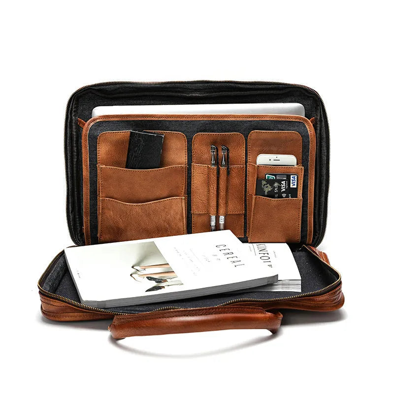 Brown vintage leather men's briefcase open showing internal laptop sleeve and multiple organisation pockets