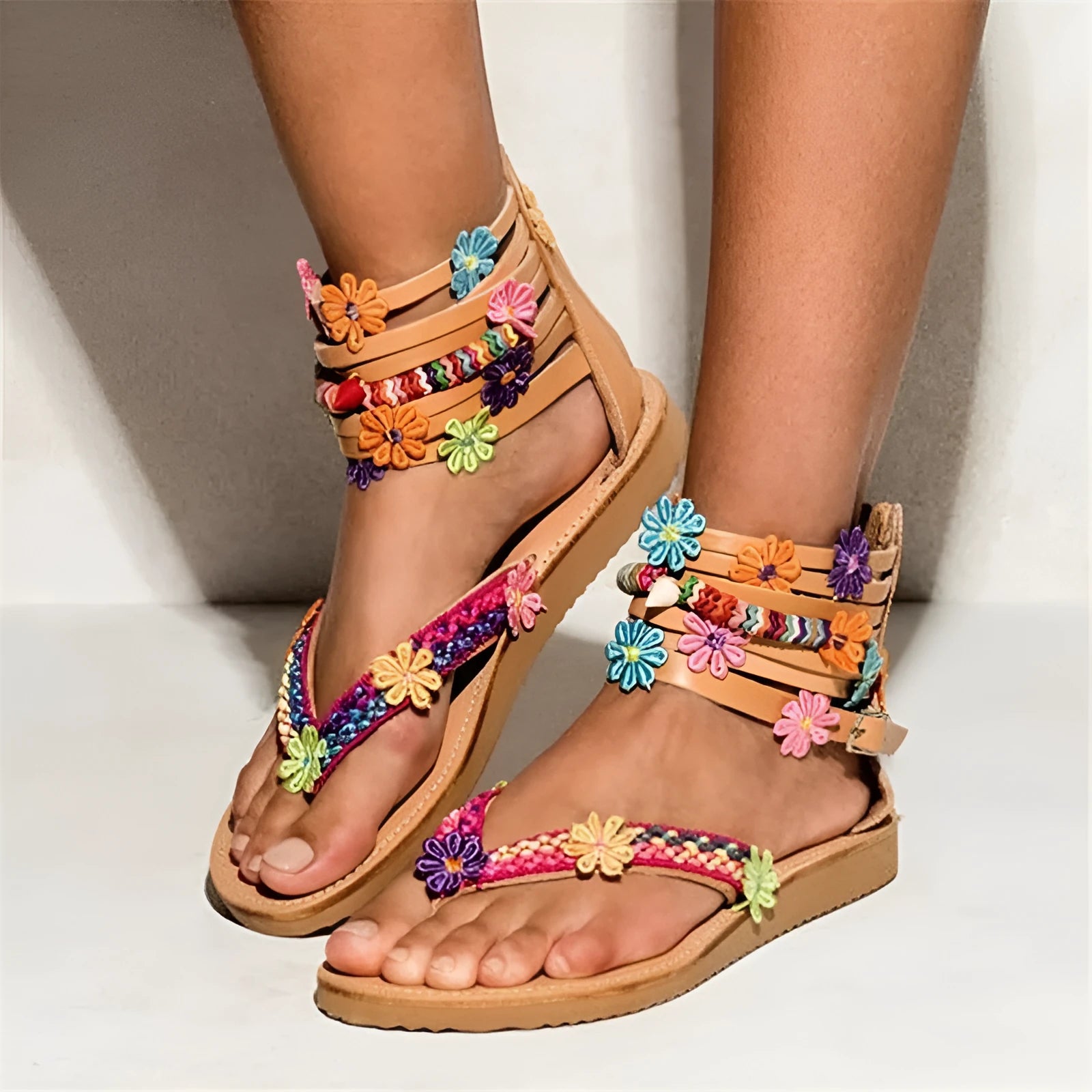 Women's ethnic style beaded petal sandals with floral decoration on a round toe PU upper.