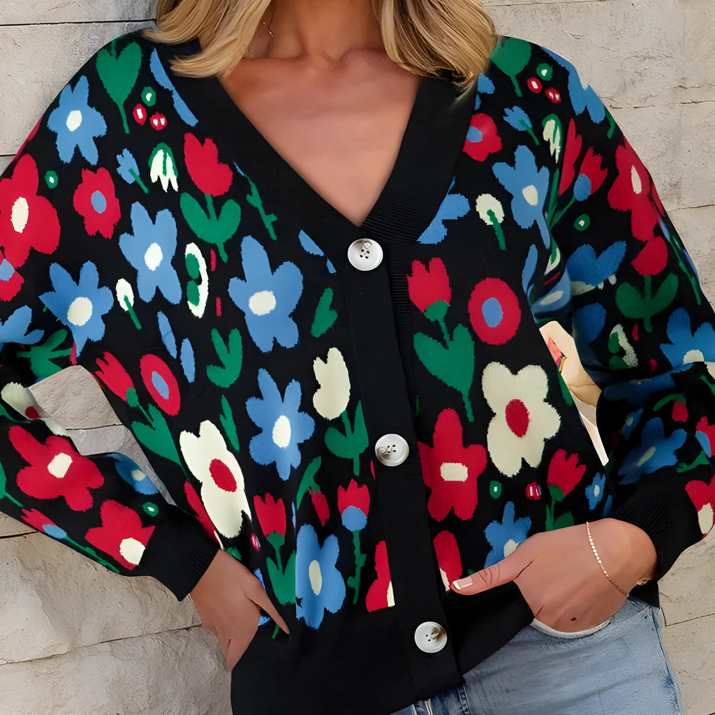 Black floral print V-neck button short cardigan sweater on model, long sleeves, shift silhouette