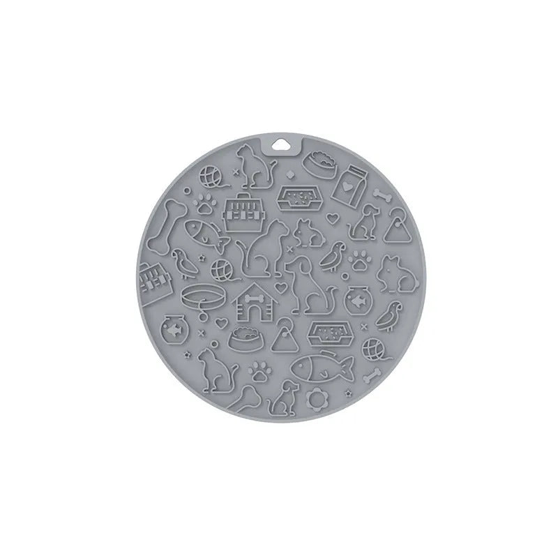 Round blue silicone pet licking mat with textured surface and white sucker on reverse.