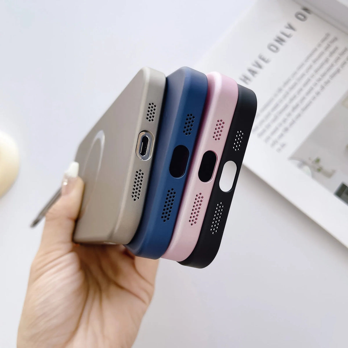 Frosted magnetic iPhone case with invisible bracket, shown in black, with lens protectors.