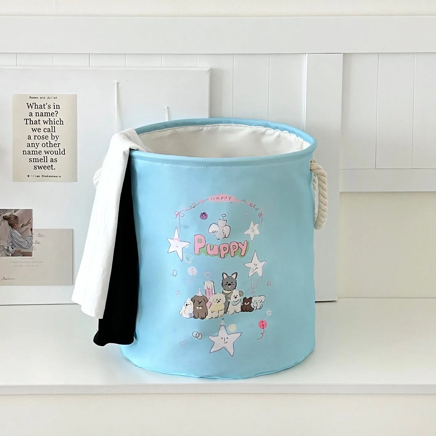 Foldable cotton cloth laundry basket in a character print colour, shown unfolded for use.