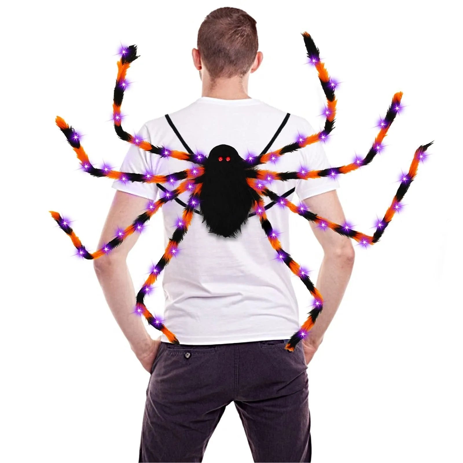 Orange plush Halloween spider backpack with purple LED lights lit up, showing the candy bag design.