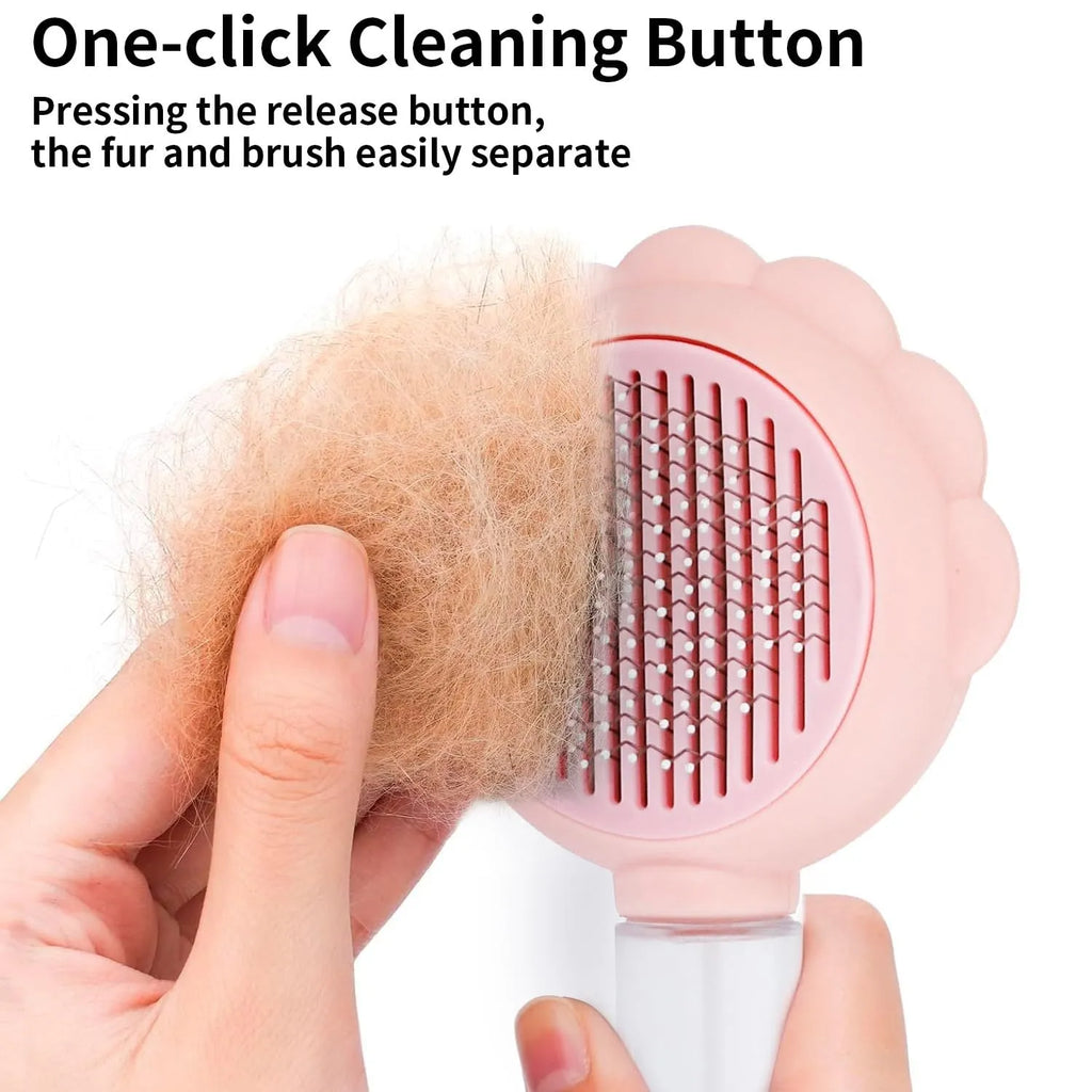 Grey spray cat brush with release button for grooming pets and removing loose hair.